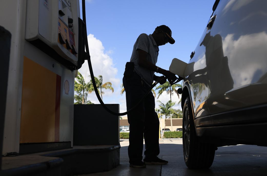 A customer pumps gas into their vehicle in Miami on October 24.